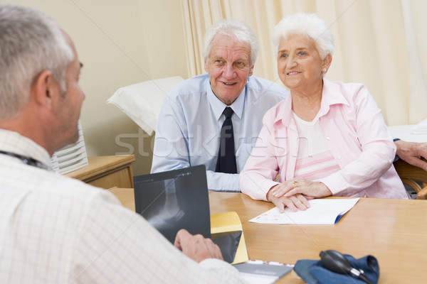 Couple in doctor's office smiling Stock photo © monkey_business