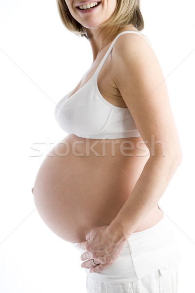 Terhes nő védtelen has mosolyog mosoly boldog Stock fotó © monkey_business