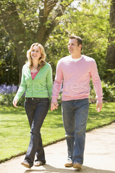 Couple mains tenant souriant homme nature [[stock_photo]] © monkey_business