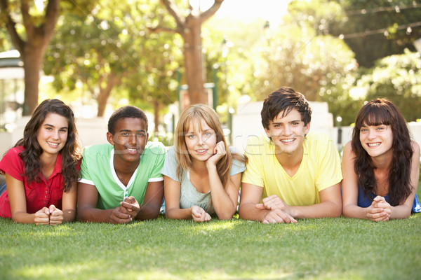 Group Of Teenagers Lying On Stomachs In Park Stock photo © monkey_business