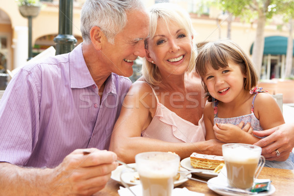 Nagyszülők leányunoka élvezi kávé torta lány Stock fotó © monkey_business