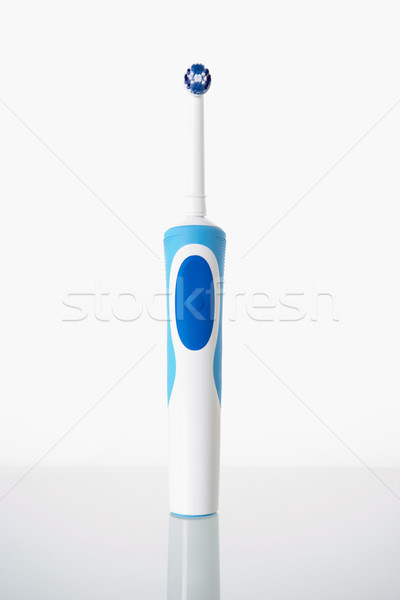 Toothbrush standing on glass shelf Stock photo © monkey_business