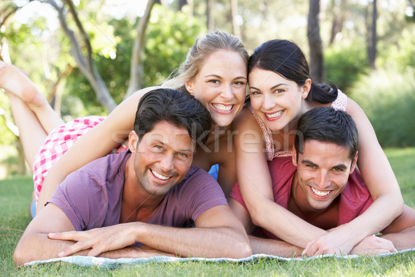 Group Of Friends Relaxing In Park Together Stock photo © monkey_business