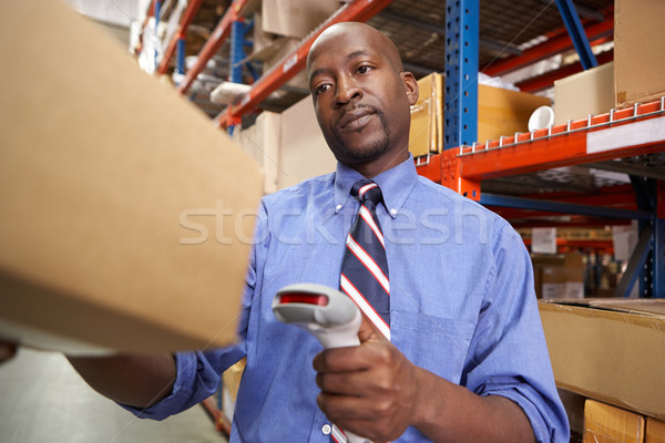 Businessman Scanning Package In Warehouse Stock photo © monkey_business