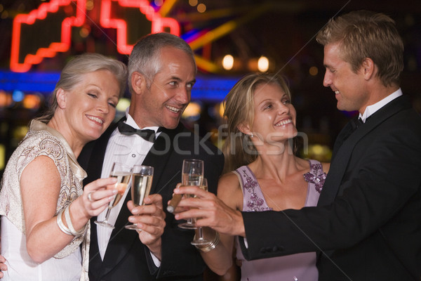Csoport barátok ünnepel győzelem kaszinó pezsgő Stock fotó © monkey_business
