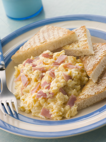 Cheesy Scrambled Egg with Ham and Toasted Triangles Stock photo © monkey_business
