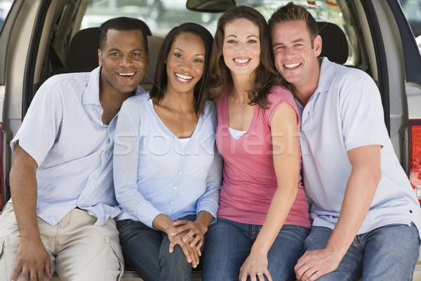 Two couples sitting in back of van smiling Stock photo © monkey_business