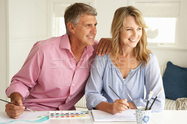 Mid age couple painting with watercolors Stock photo © monkey_business
