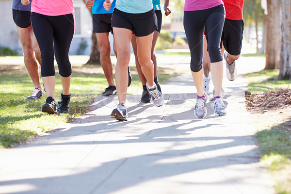 Runners piedi suburbana strada donna Foto d'archivio © monkey_business