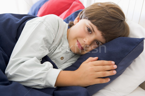 Young Boy Lying Down In His Bed Stock photo © monkey_business