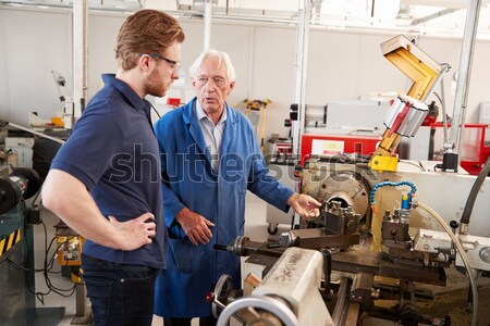 Stock photo: Two machinists working on machine