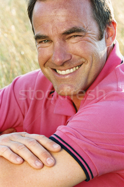 Hombre sesión aire libre sonriendo hierba feliz Foto stock © monkey_business