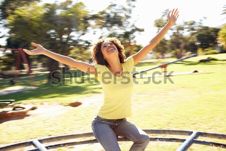 Młoda kobieta jazda konna rondo parku kobieta prędkości Zdjęcia stock © monkey_business