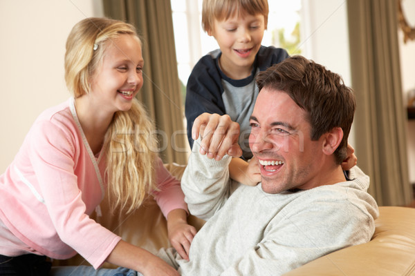 Young father with children having fun on sofa Stock photo © monkey_business