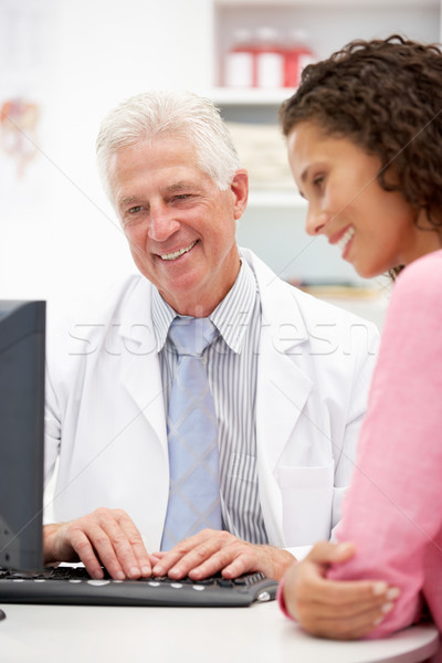 Senior doctor with female patient Stock photo © monkey_business