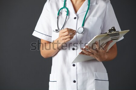 American nurse holding ink drawing stomach Stock photo © monkey_business