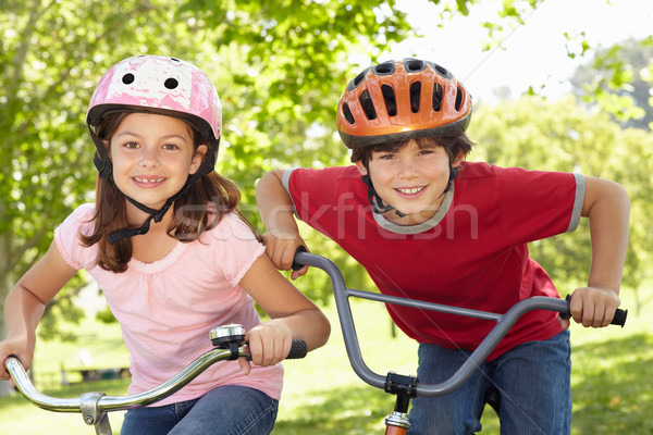 Boy and girl riding bikes Stock photo © monkey_business