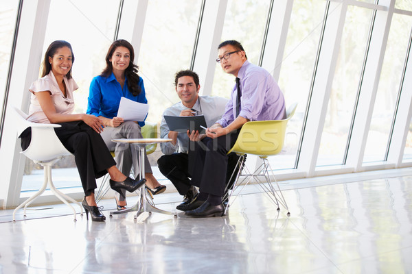 Businesspeople Having Meeting Around Table In Modern Office Stock photo © monkey_business