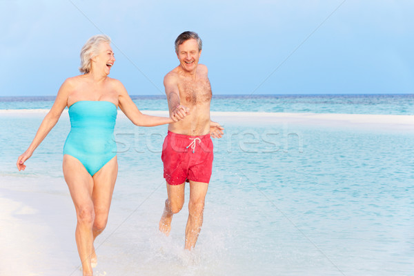 Stock photo: Senior Couple Splashing In Beautiful Tropical Sea