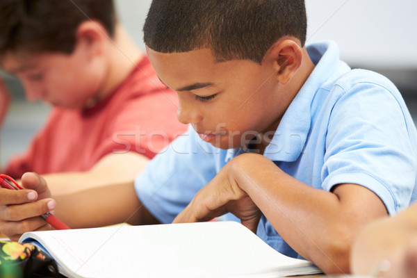 Stock photo: Pupils Studying At Desks In Classroom
