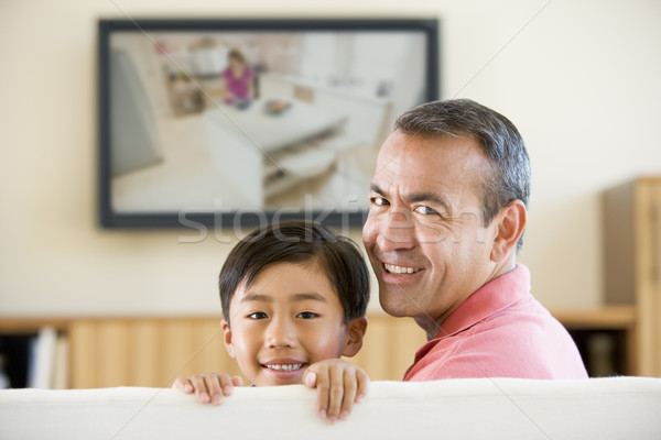 Człowiek młody chłopak salon płaski ekran telewizji dzieci Zdjęcia stock © monkey_business