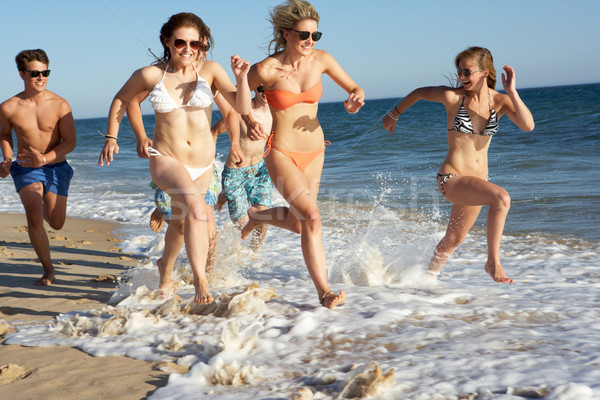 Group Of Teenage Friends Enjoying Beach Holiday Together Stock photo © monkey_business