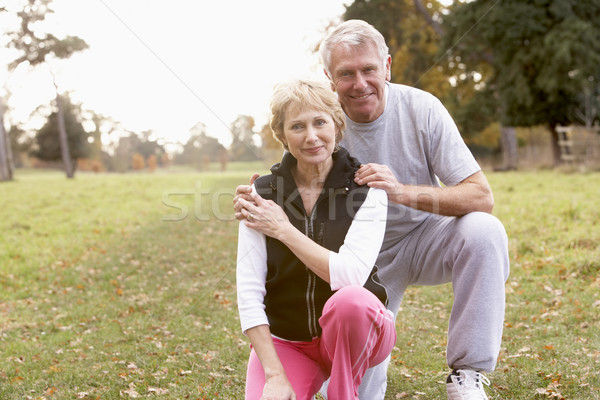 Portrait Of Senior Couple Crouching In The Park Stock photo © monkey_business