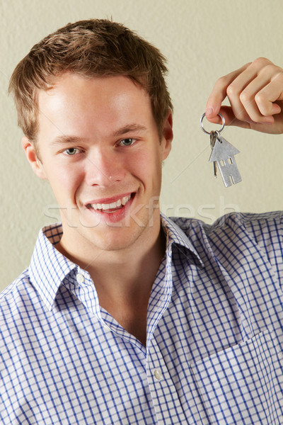 Studio Shot Of Young Man Holding Keys To First Home Stock photo © monkey_business