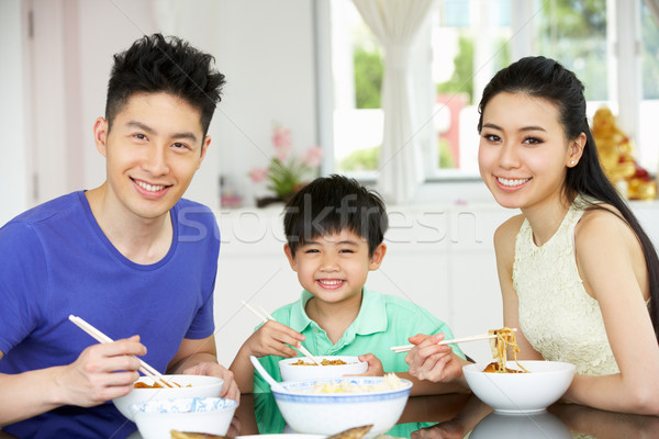 Chinese Family Sitting At Home Eating A Meal Stock photo © monkey_business