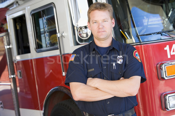 Portrait pompier pompe à incendie homme couleur permanent Photo stock © monkey_business