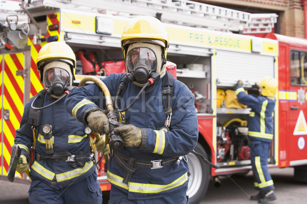 Firefighters in protective workwear Stock photo © monkey_business