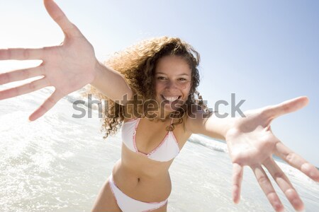 Woman jumping on bed smiling Stock photo © monkey_business