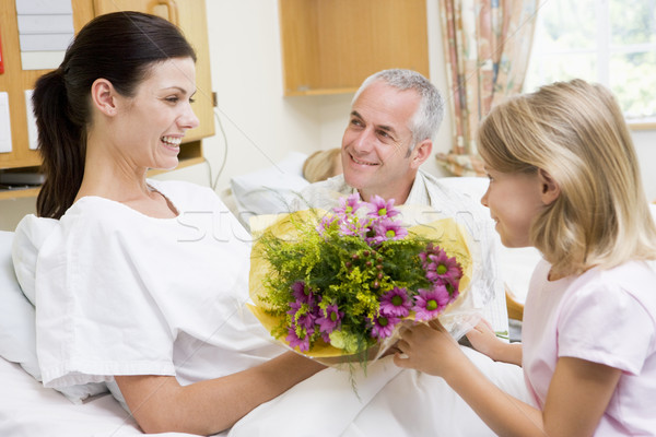 Young Girl Giving Flowers To Her Mother In Hospital Stock photo © monkey_business
