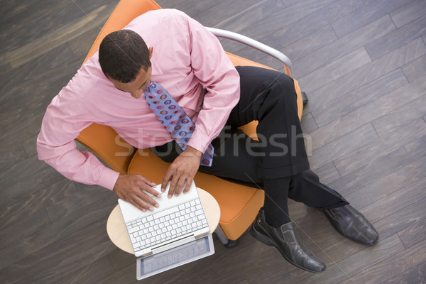 üzletember ül bent laptop férfi munka Stock fotó © monkey_business