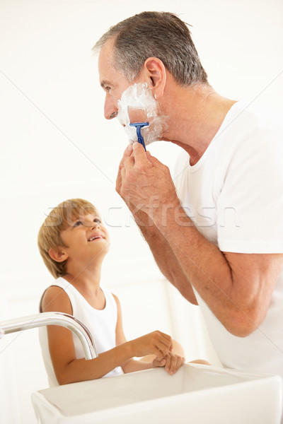 Grandson Watching Grandfather Shaving In Bathroom Mirror Stock photo © monkey_business