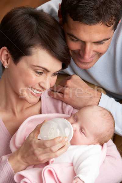 Portrait Of Parents Feeding Newborn Baby At Home Stock photo © monkey_business