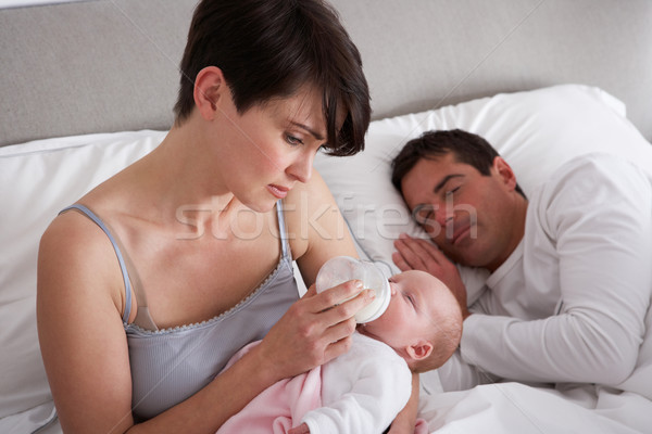 Anya etetés újszülött gyermekágy otthon lány Stock fotó © monkey_business