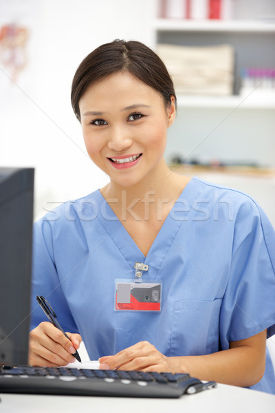 Young hospital doctor at desk Stock photo © monkey_business