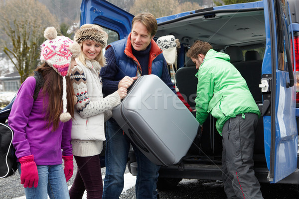 Family Unloading Luggage From Transfer Van Outside Chalet On Ski Stock photo © monkey_business