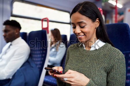 Stock foto: Geschäftsfrau · Pendeln · Arbeit · Zug · Handy · Mann