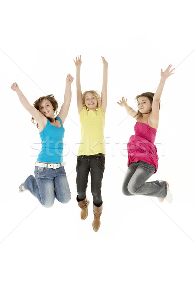 Group Of Three Young Girls Leaping In Air Stock photo © monkey_business