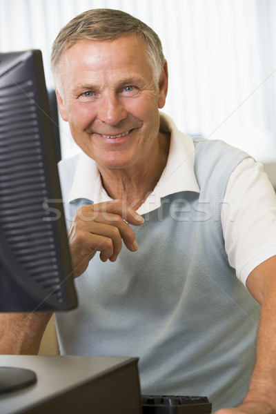 Stock photo: Senior man working on a computer