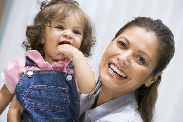 Stock photo: Mother holding young girl