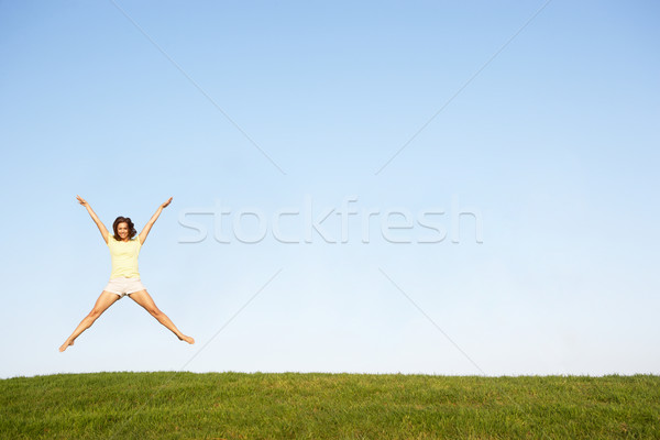 Young woman  jumping in air Stock photo © monkey_business