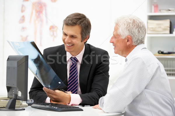 Doctor with senior patient Stock photo © monkey_business