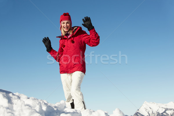 Woman Standing In Snow Wearing Warm Clothes On Ski Holiday In Mo Stock photo © monkey_business