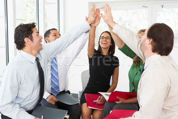 Business Team Giving One Another High Five Stock photo © monkey_business