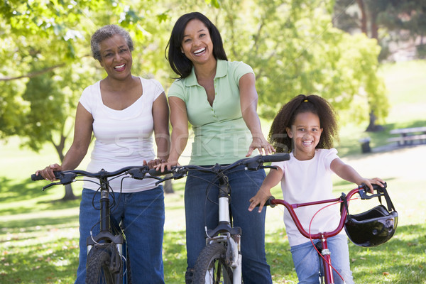 Grandmother with adult daughter and grandchild riding bikes Stock photo © monkey_business