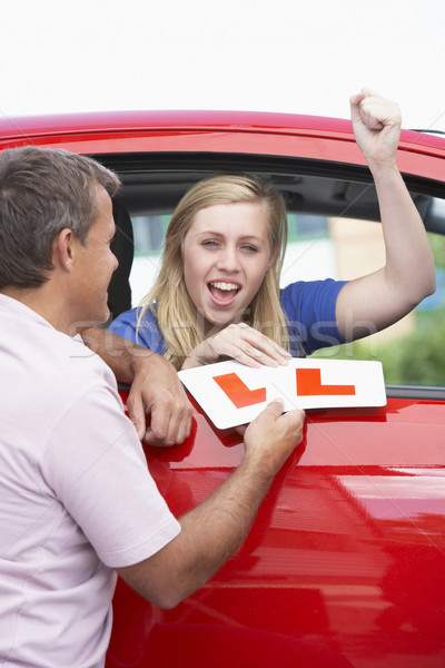 Teenage Girl Receiving Her Learner Plates Stock photo © monkey_business