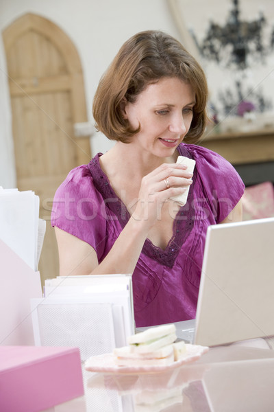 Woman eating lunch at her desk Stock photo © monkey_business